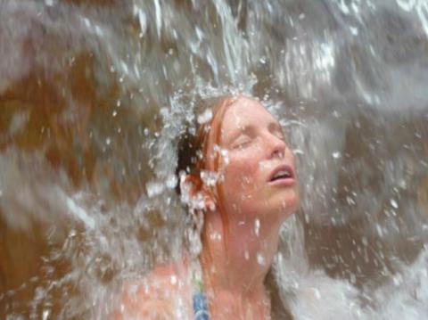 Girl Under Waterfall, Photo Courtesy of Crystal Hot Springs